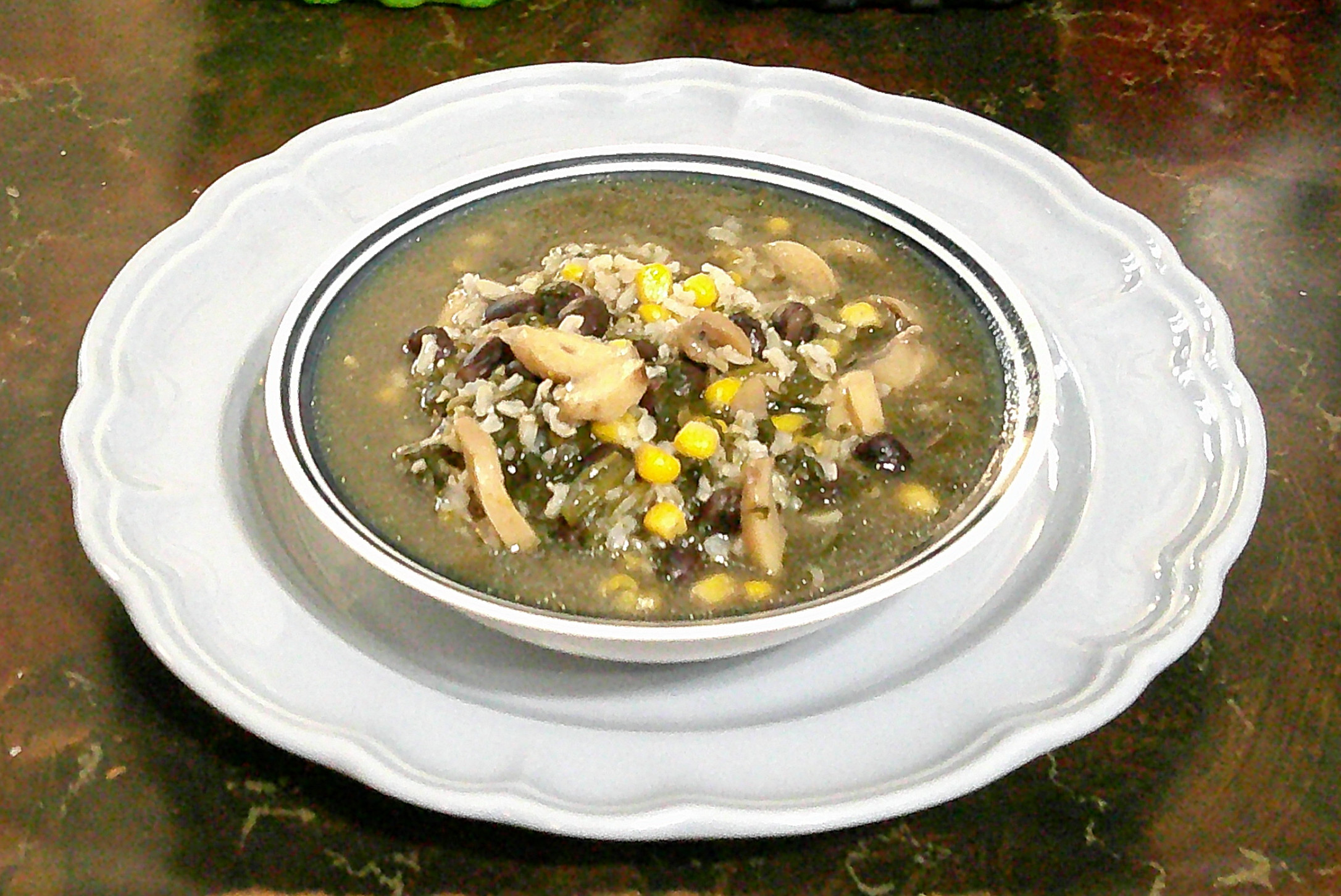 bowl of spinach stew on a plate